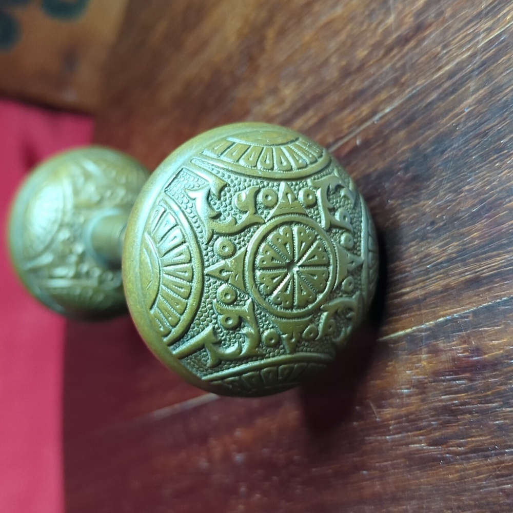 Victorian brass door knob intricate design